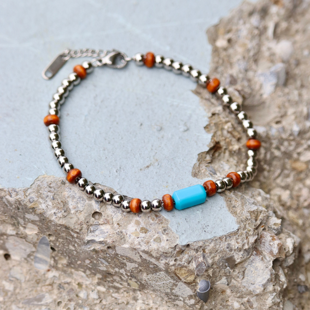 Bracciale uomo in acciaio inox con perlina celeste in resina fatta a mano