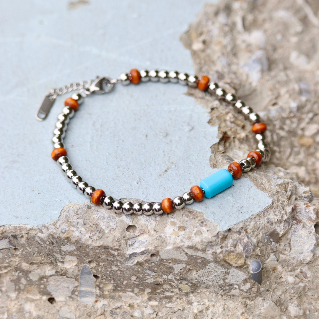 Bracciale uomo in acciaio inox con perlina celeste in resina fatta a mano