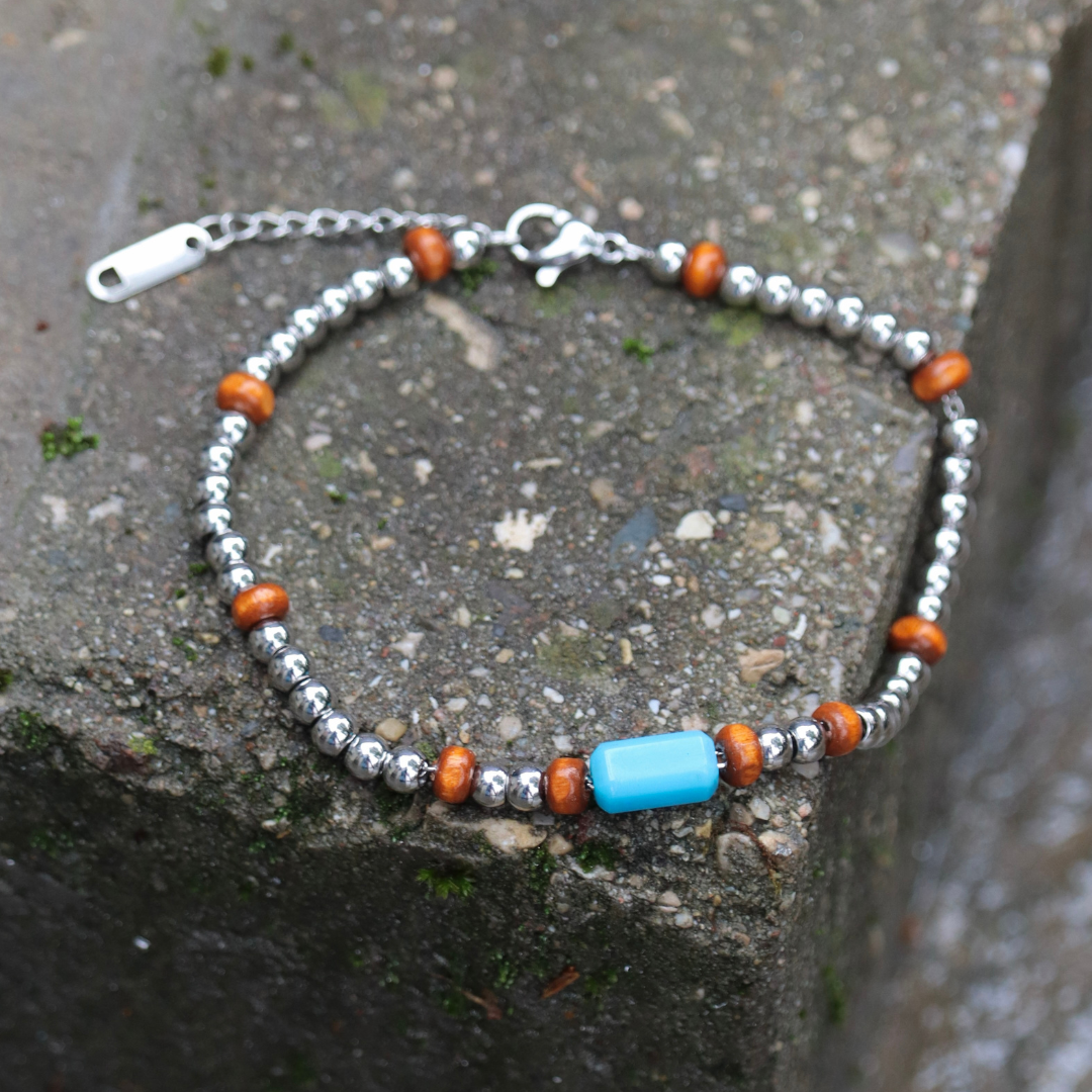Bracciale uomo in acciaio inox con perlina celeste in resina fatta a mano