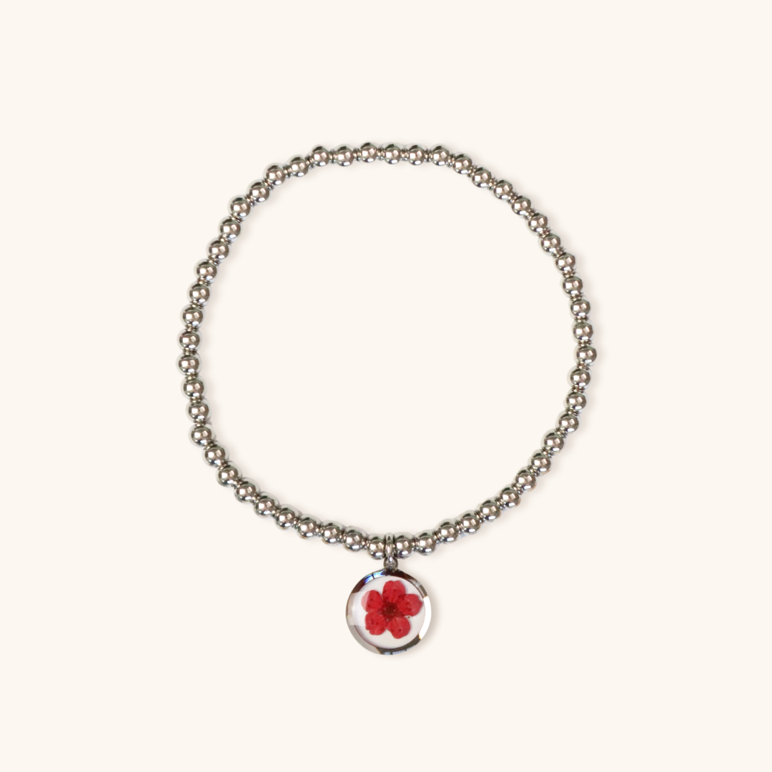 Bracciale elastico in acciaio inossidabile e ciondolo in resina con fiore rosso