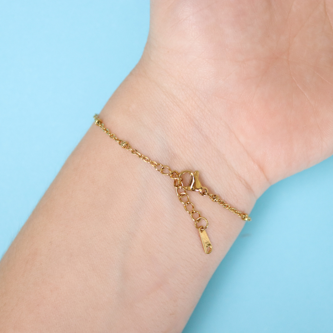Bracciale in acciaio inox e ciondolo medaglione in resina con fiore vero Nontiscordardimé