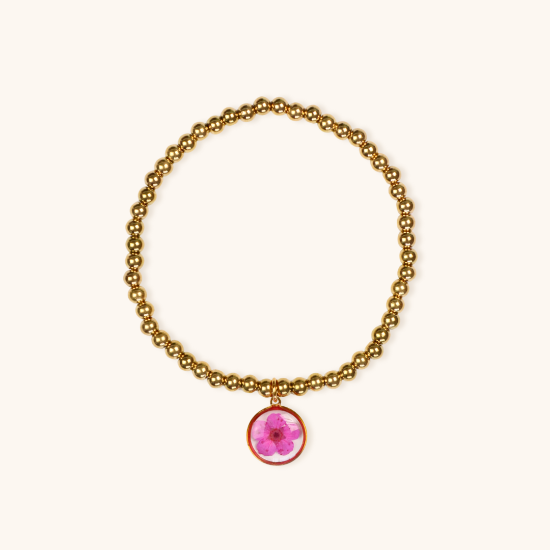 Bracciale elastico in acciaio inossidabile e ciondolo in resina con fiore fucsia
