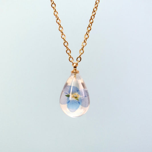 Collana RUGIADA in acciaio inossidabile e ciondolo in resina con Nontiscordardimé