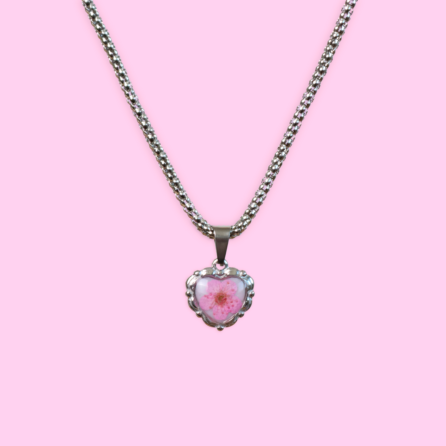 Collana cuore in acciaio inossidabile e ciondolo in resina con fiore selvatico Rosa