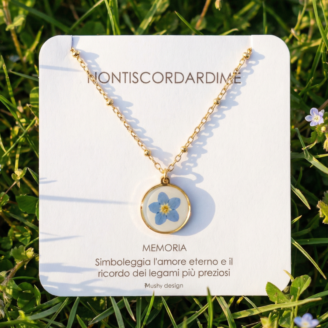 Collana in acciaio inox e ciondolo medaglione in resina con fiore vero Nontiscordardimé
