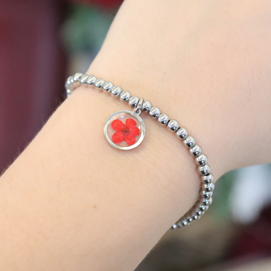 Bracciale elastico in acciaio inossidabile e ciondolo in resina con fiore rosso