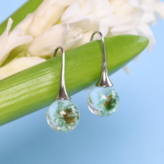 Orecchini pendenti in resina con Glixia azzurro e acciaio inox - collezione BOLLE