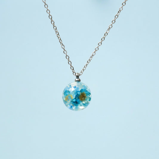 Collana BOLLA in acciaio inox con sfera in resina e fiori di Glixia blu