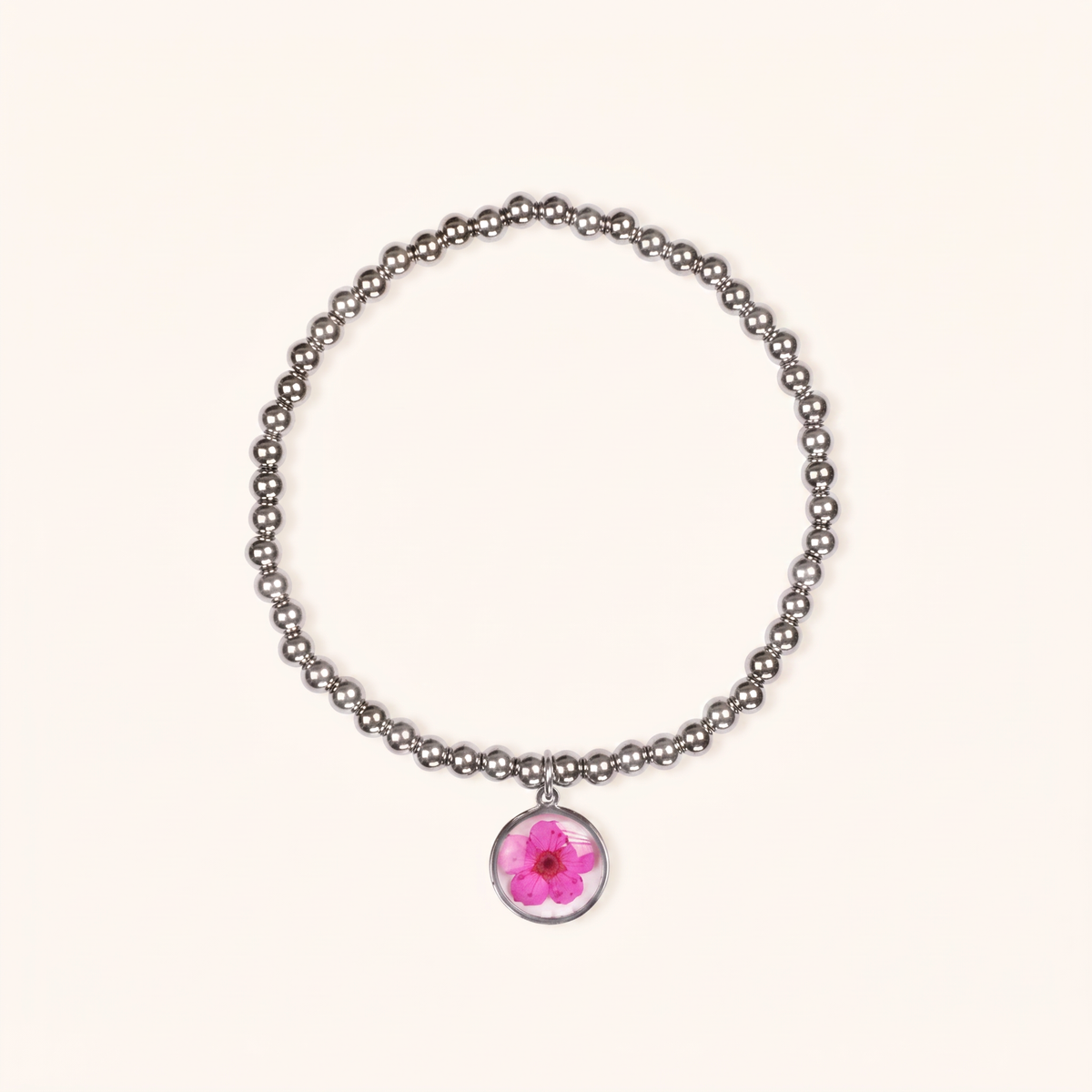 Bracciale elastico in acciaio inossidabile e ciondolo in resina con fiore fucsia