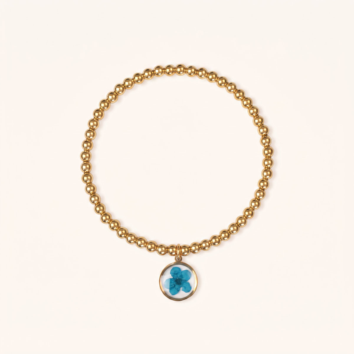 Bracciale elastico in acciaio inossidabile e ciondolo in resina con fiore blu