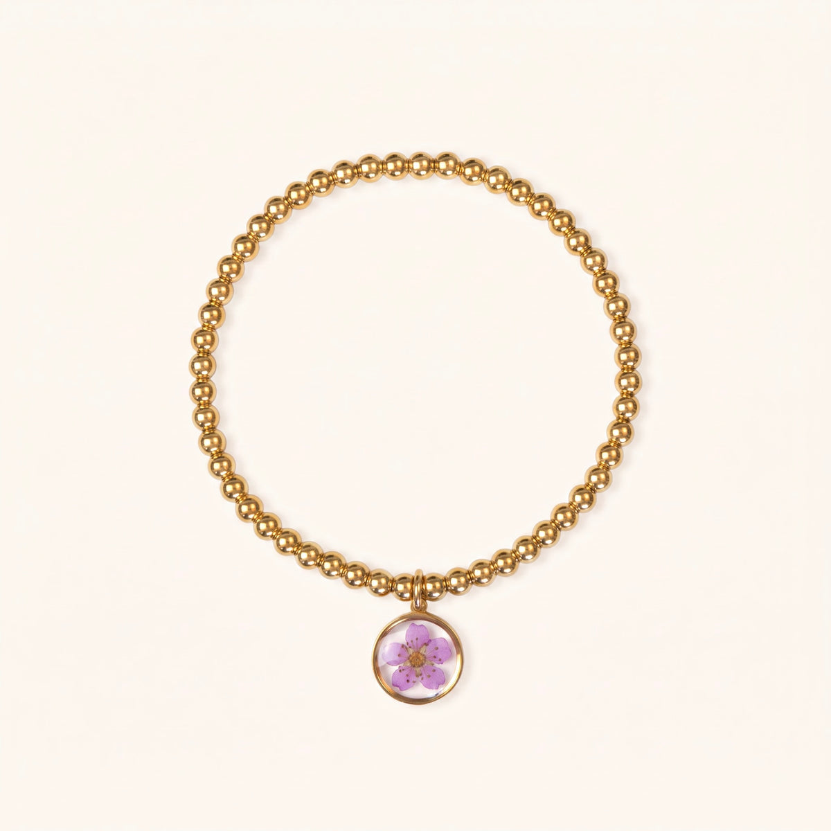 Bracciale elastico in acciaio inossidabile e ciondolo in resina con fiore viola