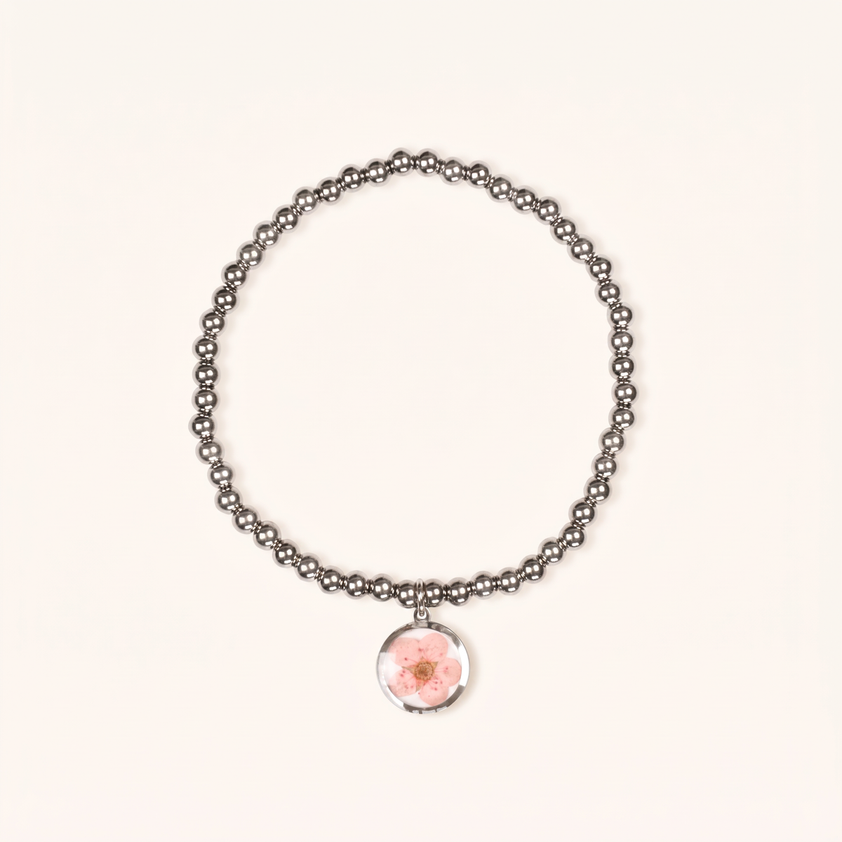 Bracciale elastico in acciaio inossidabile e ciondolo in resina con fiore rosa