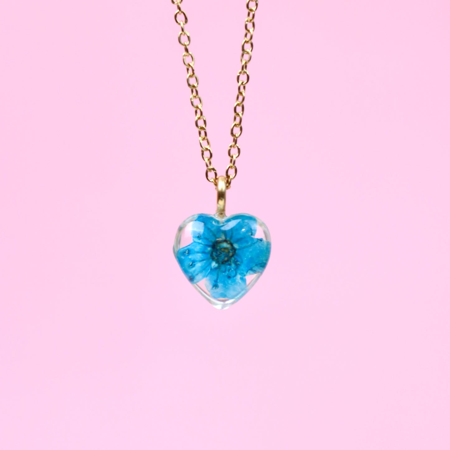 Collana con fiore vero blu ciondolo a cuore in resina con montatura in acciaio inossidabile